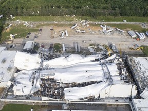 Debris is scattered around the Pfizer facility on Wednesday, July 19, 2023, in Rocky Mount, N.C., after damage from severe weather.