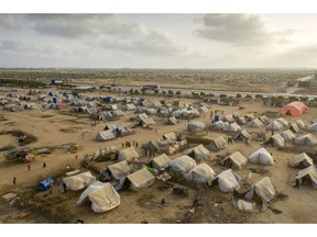 The refugee camp outside Karachi in May. "The already difficult living conditions of people affected by the 2022 flooding in Pakistan have been further exacerbated by the rain, making them even more vulnerable to future flooding," the UN noted in a recent report.  Photographer: Asim Hafeez/Bloomberg