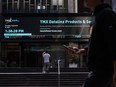 Pedestrians pass in front of the Toronto Stock Exchange in the financial district of Toronto.