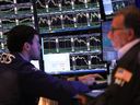 Traders work on the floor of the New York Stock Exchange.