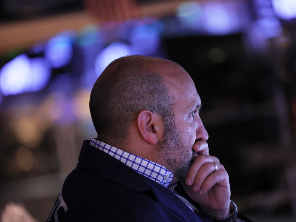 Traders work on the floor of the New York Stock Exchange.