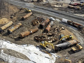 FILE - Cleanup continues on Feb. 24, 2023, at the site of a Norfolk Southern freight train derailment that happened on Feb. 3 in East Palestine, Ohio. The union that represents locomotive engineers says a coal train derailment in Virginia Thursday, July 6, is renewing questions about Norfolk Southern's safety practices.