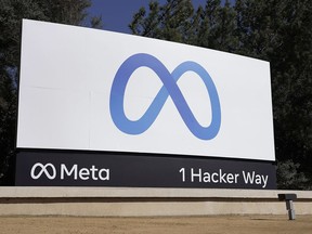 FILE - Facebook's Meta logo sign is seen at the company headquarters in Menlo Park, Calif., on, Oct. 28, 2021. U.S. Facebook users have one more month to apply for their share of a $725 million privacy settlement that parent company Meta agreed to pay late last year. Meta is paying to settle a lawsuit alleging the world's largest social media platform allowed millions of its users' personal information to be fed to Cambridge Analytica, a firm that supported Donald Trump's 2016 presidential campaign.
