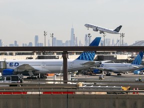 FILE A plane takes off from Newark Liberty International Airport in Newark, New Jersey, on Monday, February 27, 2023, with One World Trade Center and the lower Manhattan skyline visible in the background. The Federal Aviation Administration, which was heavily criticized for the way it approved the Boeing 737 Max before two deadly crashes, said Wednesday, July 26, 2023, that it is more clearly explaining the kind of critical safety information that must be disclosed to the agency.