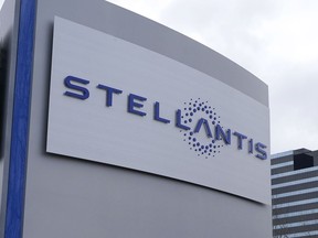 FILE - A Stellantis sign is seen outside the Chrysler Technology Center, Jan. 19, 2021, in Auburn Hills, Mich. Stellantis says that when it starts to sell compact and midsize electric vehicles off new underpinnings next year, they will be able to go up to 435 miles (700 kilometers) per charge. The company made the claim Wednesday, July 5, 2023, as it unveiled its new medium-sized platform designed for the purpose of housing battery packs and electric drive trains.