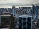 Office towers, condos and apartment buildings are seen in downtown and the west end of Vancouver. CBRE says the national office vacancy rate in Canada climbed in the second quarter.
