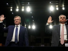 Ron Price, chief operating officer of the PGA Tour, left, and PGA Tour policy board member Jimmy Dunne are sworn in during a Senate Homeland Security Subcommittee on Investigations hearing examining the business deal between the PGA Tour and the Public Investment Fund of Saudi Arabia's LIV Golf in Washington on July 11.