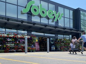 Shoppers at a west-end Toronto Sobeys grocery store, Sunday, June 26, 2023. The Canadian Chamber of Commerce says while consumer spending remained strong in the second quarter, it turned a corner after the Bank of Canada announced another interest rate hike in June.