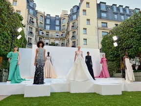 A range of dresses on display by Saudi designers at a Paris Fashion Week event in July at the Ritz. Photographer: Lisa Fleisher/Bloomberg