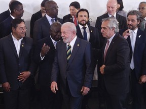 FILE - Leaders, front row from left: Bolivia's President Luis Arce, Brazil's President Luiz Inacio Lula da Silva and Argentina's President Alberto Fernandez, arrive for a group photo during the Community of Latin American and Caribbean States (CELAC) Summit in Buenos Aires, Argentina, Tuesday, Jan. 24, 2023. Over 50 leaders from the European Union and Central and South America are meeting for a two-day summit starting Monday, July 17, 2023, eager to re-engage after an eight-year hiatus, but the war in Ukraine, trade and even slavery reparation could make it a less than joyful experience.