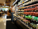  A shopper makes her way through a grocery store on July 12, 2023, in Miami. The U.S. consumer price index report showed that inflation fell to its lowest annual rate in more than two years during June.