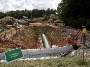 FILE - Construction crews are boring beneath U.S. 221 in Roanoke County, Va., to make a tunnel through which the Mountain Valley Pipeline will pass under the highway, seen on Friday, June 22, 2018. A federal appeals court Monday, July 10, 2023, has again blocked construction on a segment of a contentious natural gas pipeline being built through Virginia and West Virginia, this time doing so even after Congress ordered the project's approval.
