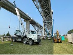 Contractors working under First Blue Water Bridge. Photo: The FBCL