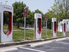 FILE - A Tesla electronic vehicle charging station is seen Thursday, May 25, 2023, in Nashville, Tenn. The Biden administration is making available $20 billion from a federal "green bank" for clean energy projects such as residential heat pumps, electric vehicle charging stations and community cooling centers.
