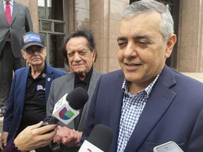 FILE - Former U.S. Rep. David Rivera speaks with media outside Miami federal court, in Miami, Dec. 20, 2022. The former Miami congressman who signed a $50 million consulting contract with Venezuela's socialist government not only did no apparent work, but also channeled a large chunk of the money to a yacht company on behalf of a fugitive billionaire, according to new allegations in a civil suit filed Friday, July 28, 2023.