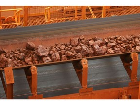 A conveyor transports iron ore from the scrubbing and wet screening facilities at Fortescue Metals Group Ltd.'s Solomon Hub mining operations in the Pilbara region, Australia, on Thursday, Oct. 27, 2016. Shares in Fortescue, the world's No. 4 iron ore exporter, have almost trebled in 2016 as iron ore recovered, and the company cut costs and repaid debt. Photographer: Brendon Thorne/Bloomberg