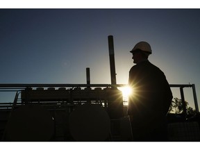 A Santos Ltd. operator looks on at the company's Wilga Park power station in Narrabri, Australia, on Thursday, May 25, 2017. A decade after the shale revolution transformed the U.S. energy landscape, Australia -- poised to overtake Qatar as the world's biggest exporter of liquefied natural gas -- is experiencing its own quandary over natural gas. Photographer: Brendon Thorne/Bloomberg