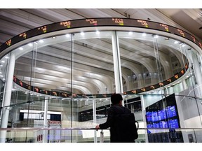 An electronic ticker displays share prices at the Tokyo Stock Exchange Photographer: Keith Bedford/Bloomberg