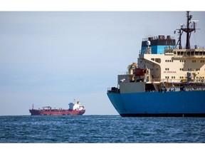 The Maersk Piper, a crude oil tanker operated by AP Moller - Maersk A/S, right, sits at anchor off the coast of Southwold, U.K., on Friday, May 15, 2020. Nine tankers carrying about 5.58 million barrels of North Sea crude that loaded in April are floating off U.K. ports, according to ship-tracking data compiled by Bloomberg.