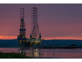 A mobile offshore drilling unit stands illuminated at night in the Port of Cromarty Firth in Cromarty, U.K., on Tuesday, June 23, 2020. Oil headed for a weekly decline -- only the second since April -- as a surge in U.S. coronavirus cases clouded the demand outlook, though the pessimism was tempered by huge cuts to Russia's seaborne crude exports.