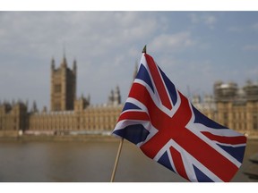 LONDON, ENGLAND - AUGUST 09: A Union Jack flag outside the Houses of Parliament on August 9, 2020 in London, United Kingdom. Southern England saw several days of high temperatures, with the mercury hitting 36.4C at Heathrow and Kew Gardens, England's hottest August day in 17 years.