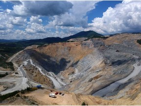 The excavated terrain of the Veliki Krivelj open pit copper mine, operated by Zijin Mining Group Co., in the Bor Region, Serbia. Photographer: Oliver Bunic/Bloomberg