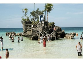 The Lourdes grotto in Boracay is one of the most overvisited sites on the fragile Philippine island, which closed entirely to tourists for six months in 2018. Photographer: Veejay Villafranca/Bloomberg