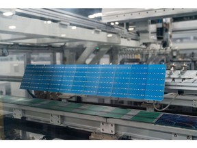 Solar cells during the assembly process at the Hanwha Q Cells solar cell and module manufacturing facility in Dalton, Georgia, US, on Thursday, Oct. 6, 2022. Once a stronghold of the conservative South, Georgia has emerged as both a hub of so-called cleantech manufacturing and a political swing state.