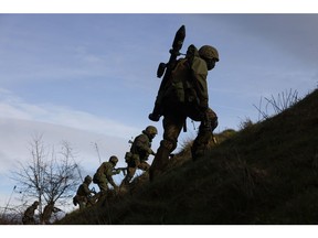 Ukrainian military recruits take part in a trench training exercise conducted by British and Dutch army personnel in the north of England on Feb. 16, 2023.