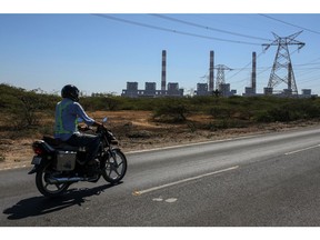 The Mundra Thermal Power Plant of Adani Power Ltd., in Mundra, Gujarat, India, on Thursday, Feb. 9, 2023. The Mundra Thermal Power Plant, which can light up millions of homes, has more liabilities than assets and has run up $1.8 billion of losses. Photographer: Dhiraj Singh/Bloomberg