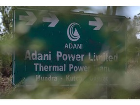 Signage of the Adani Power Ltd., Mundra Thermal Power station sit on displayed in Mundra, Gujarat, India, on Thursday, Feb. 9, 2023. Photographer: Dhiraj Singh/Bloomberg