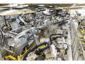 Robotic arms operate on the production line of the Zeekr Co. 009 electric luxury minivan at Zhejiang Geely Holding Group Co.'s Zeekr Intelligent Factory in Ningbo, Zhejiang Province, China, on Wednesday, Feb. 22, 2023. Geely, one of China's largest carmakers, has joined a local price war by offering discounts of as much as 30,000 yuan ($4,350) on some of its models. Photographer: Qilai Shen/Bloomberg