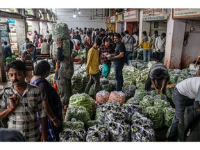 Bags of vegetables at a wholesale market in Ahmedabad, India, on Wednesday, July 19, 2023. A spike in inflation in June justifies the decision of Indian policymakers to maintain higher rates for longer, the country's central bank said in a report.