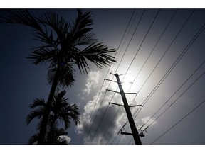 Power lines during a heat wave in Miami, Florida, US, on Tuesday, July 25, 2023. Heat advisories and excessive heat warnings stretch from California's Central Valley to Miami. Photographer: Eva Marie Uzcategui/Bloomberg