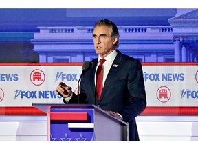 Doug Burgum, governor of North Dakota and 2024 Republican presidential candidate, during the Republican primary presidential debate hosted by Fox News in Milwaukee, Wisconsin, US, on Wednesday, Aug. 23, 2023. Republican presidential contenders are facing off in their first debate of the primary season, minus frontrunner Donald Trump, who continues to lead his GOP rivals by a double-digit margin.