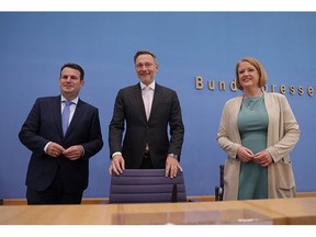 BERLIN, GERMANY - AUGUST 28: German Finance Minister Christian Lindner (C) of the German Free Democrats (FDP), Families Minister Lisa Paus of the Greens Party and Labour and Social Affairs Minister Hubertus Heil of the German Social Democrats (SPD) arrive to present the coalition agreement on minimum child benefits on August 28, 2023 in Berlin, Germany. The new legislation will allocate EUR 2.4 billion with the aim of alleviating child poverty in Germany.