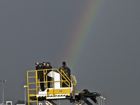 Secret service agents watch through their binoculars as a rainbow appears in the sky before President Barack Obama arrived at Bole International Airport in Addis Ababa, Ethiopia, on July 26, 2015. Members of Ethiopia's LGBTQ+ community say they face a wave of online harassment and physical attacks and blame much of it on the social media platform TikTok, which they say is failing to take down posts calling for homosexual and transgender people to be whipped, stabbed and killed.