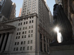 A statue of George Washington overlooks Wall Street and the New York Stock Exchange. The bond market, which is arguably the most influential in the world, is now facing one of its biggest tests in generations.