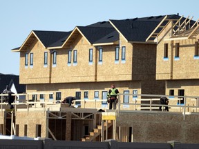 Construction crews work on a housing project in Regina.