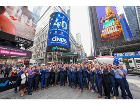 Cintas employee partners celebrating their 40th anniversary of going public and being listed on the Nasdaq exchange in Times Square.