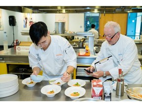Judge/Chef Roland Passot (right) evaluates contestant Marcus Youn during the chef competition of Young Chef Young Waiter USA on Aug. 21, 2023, at the CIA at Copia. Youn would go on to win first place in the competition and heads to Monaco to compete in the world finals in November.