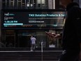 Pedestrians pass in front of the Toronto Stock Exchange in the financial district of Toronto.