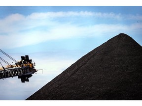 An excavator at a working coal mine in the Port of Newcastle. Photographer: Bloomberg Creative Photos/Bloomberg Creative Collection