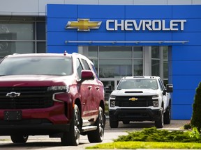 Statistics Canada says retail sales rose 0.1 per cent to $65.9 billion in June, helped higher by sales at new car dealers. A Chevrolet vehicle logo is pictured on a car at an automotive dealership in Ottawa on Friday, Aug. 11, 2023.