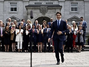 Prime Minister Justin Trudeau will hold a cabinet retreat in Charlottetown starting on Monday. Members of the federal cabinet applaud as Prime Minister Justin Trudeau arrives for a media availability after a cabinet shuffle, at Rideau Hall in Ottawa, on Wednesday, July 26, 2023.