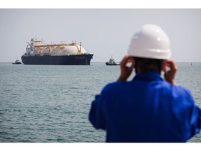 A worker standing on the uploading dock of Cavaou LNG terminal in Fos-sur-Mer, June 22 Photographer: Clement Mahoudeau/AFP/Getty Images