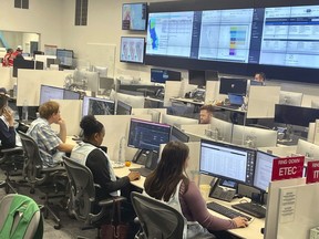 Pacific Gas & Electric employees monitor wind conditions at their Emergency Response Center in Vacaville, Calif., Wednesday, Aug. 30, 2023. PG&E cut power to roughly 8,400 Northern California customers Wednesday as gusty winds and low humidity boosted wildfire risk.