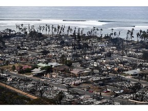 Destroyed homes and buildings in Lahaina in the aftermath of wildfires in western Maui, Hawaii, on Aug 10 Photographer: Patrick T. Fallon/AFP/Getty Images