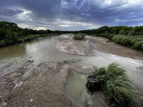 Sandbars are expanding in the Rio Grande as flows decrease through Albuquerque, N.M., on Thursday, Aug. 17, 2023. Water managers are warning than more stretches of the river near New Mexico's largest city are expected to go dry without more rain.