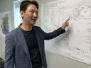 NextStar Energy chief executive Danies Lee shows blueprints of the Windsor battery plant in July. By the time hiring is complete in 2025, the plant will have 2,500 employees.

